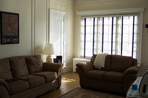 a living room with two couches and a window