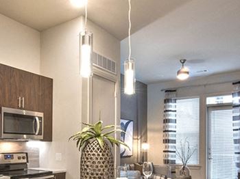 Kitchen with Chic Pendant Lighting at Windsor Turtle Creek, Texas, 75219
