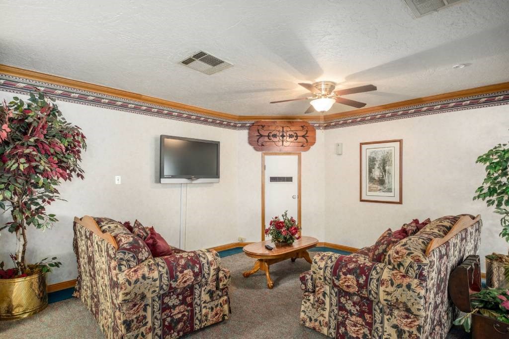 a living room with couches and a television