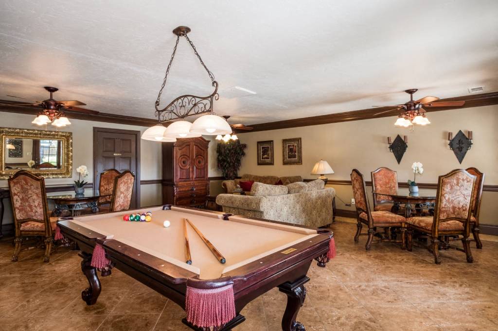 a living room with a pool table