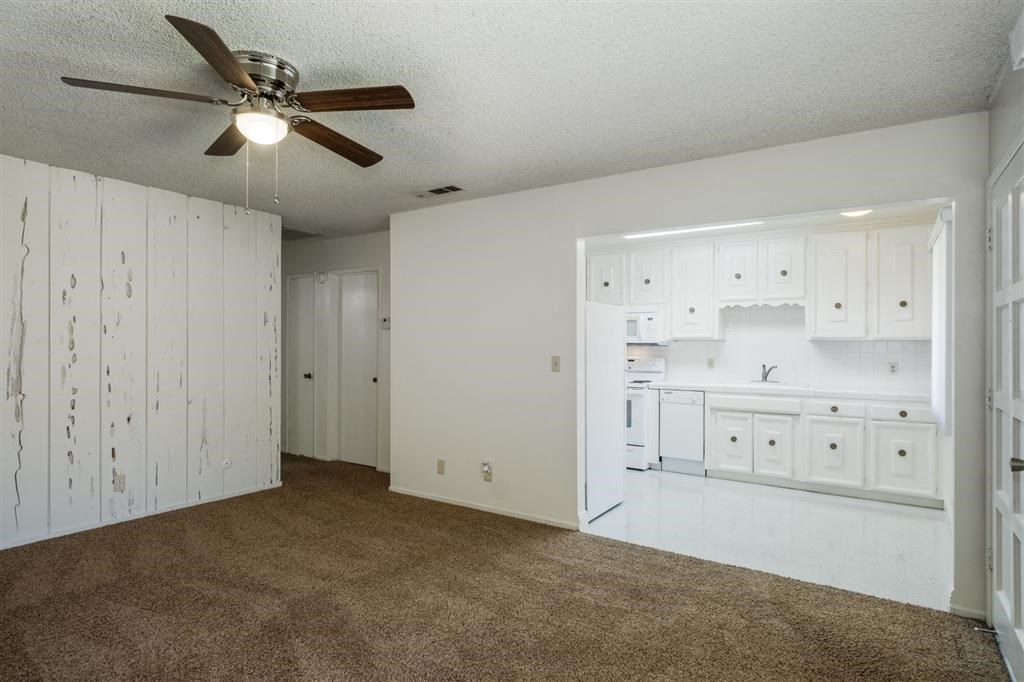 Kitchen With White Cabinetry And Appliances at Reef Apartments, California, 93704