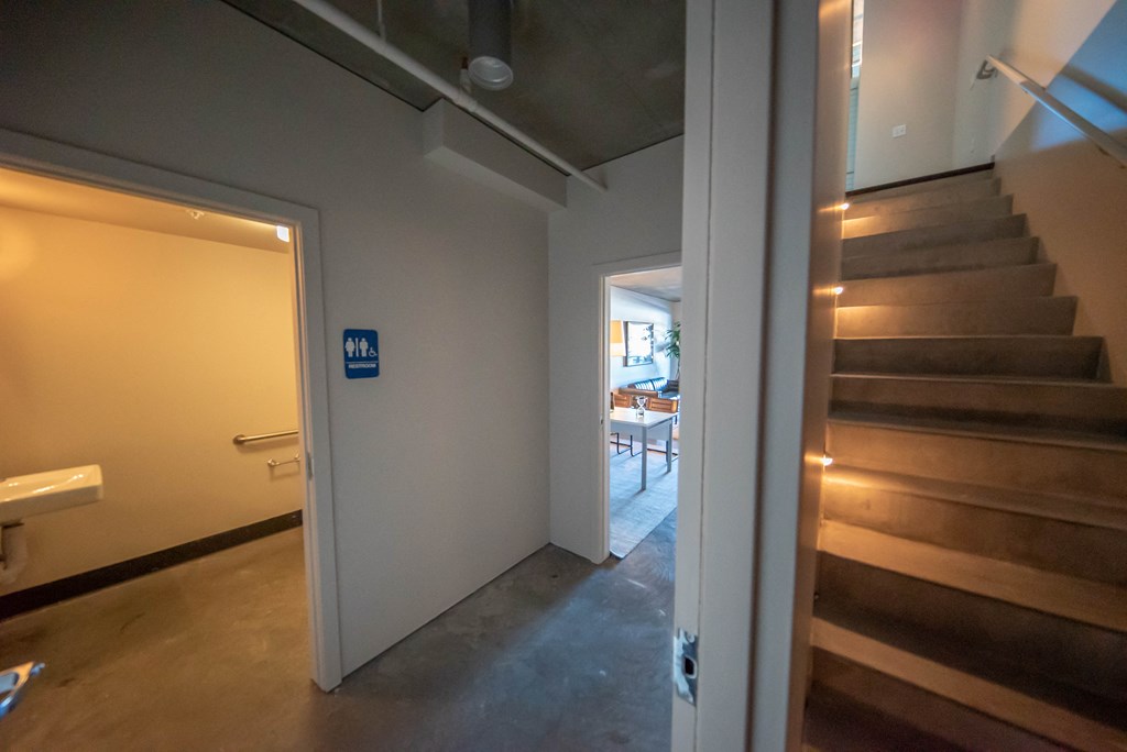Bathroom in Hallway of Community Space at 10th and G Apartments in San Diego, CA