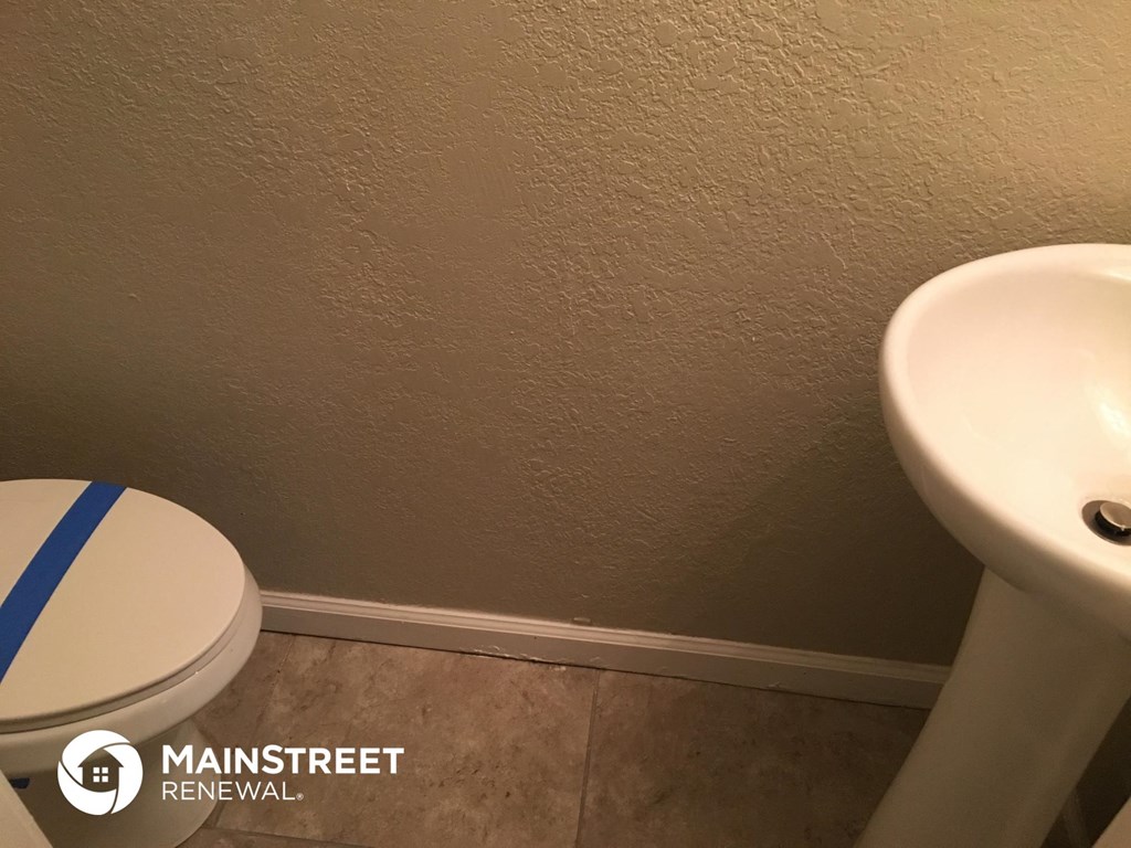 a bathroom with a toilet and a sink