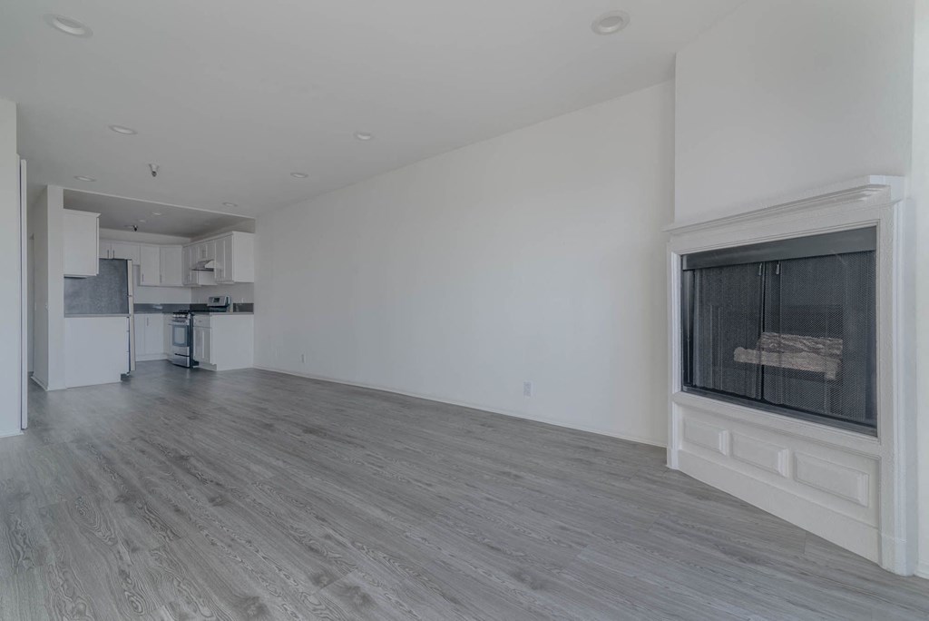 Living room with fireplace and kitchen