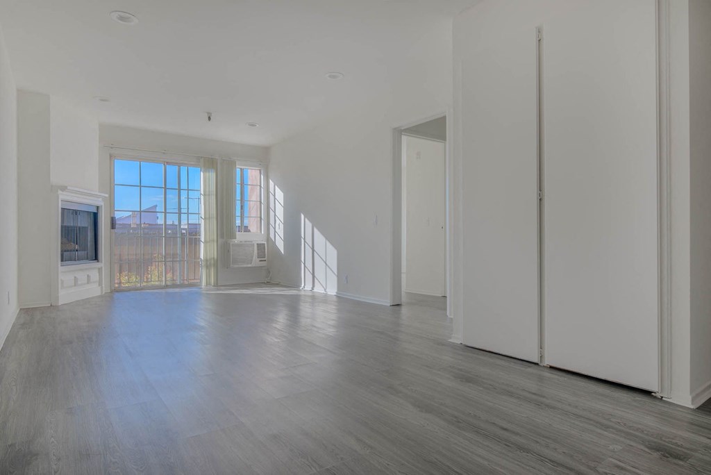 Living room with fireplace and balcony