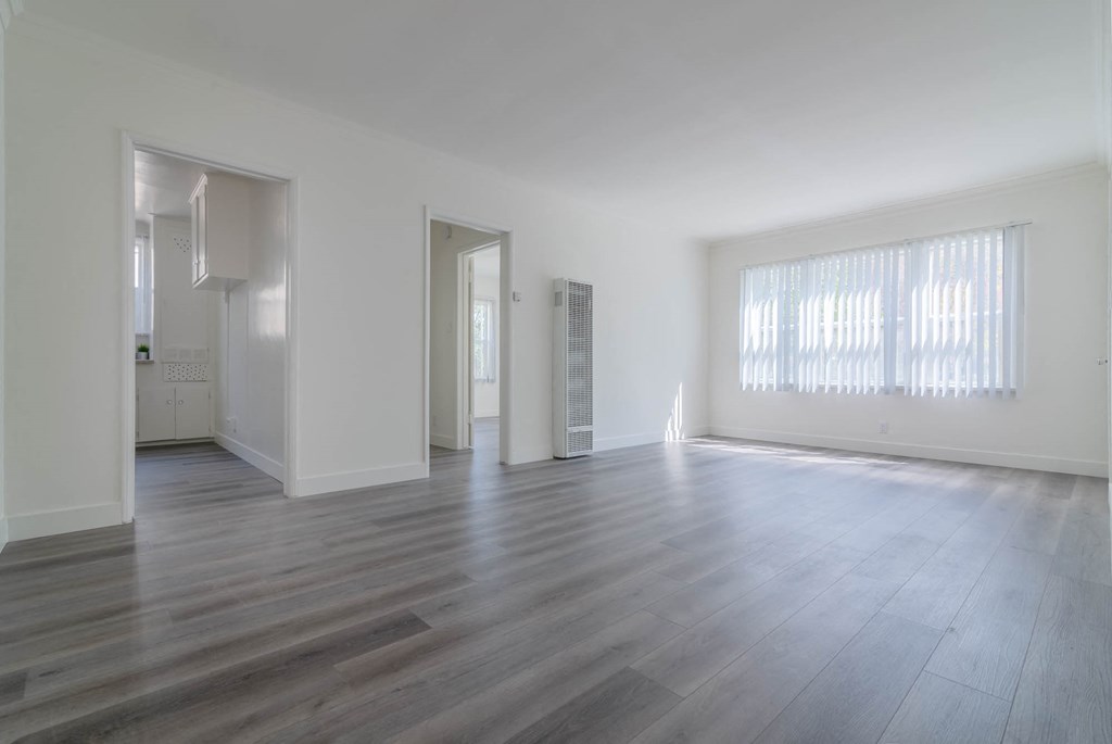 Living area with 3 large windows and view