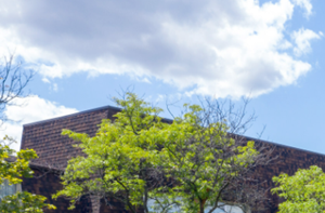 a brick building with cars parked in front of it