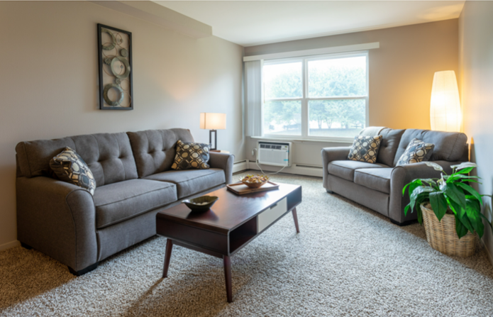 a living room with couches and a coffee table