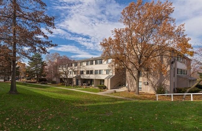 a building on the side of a grass field