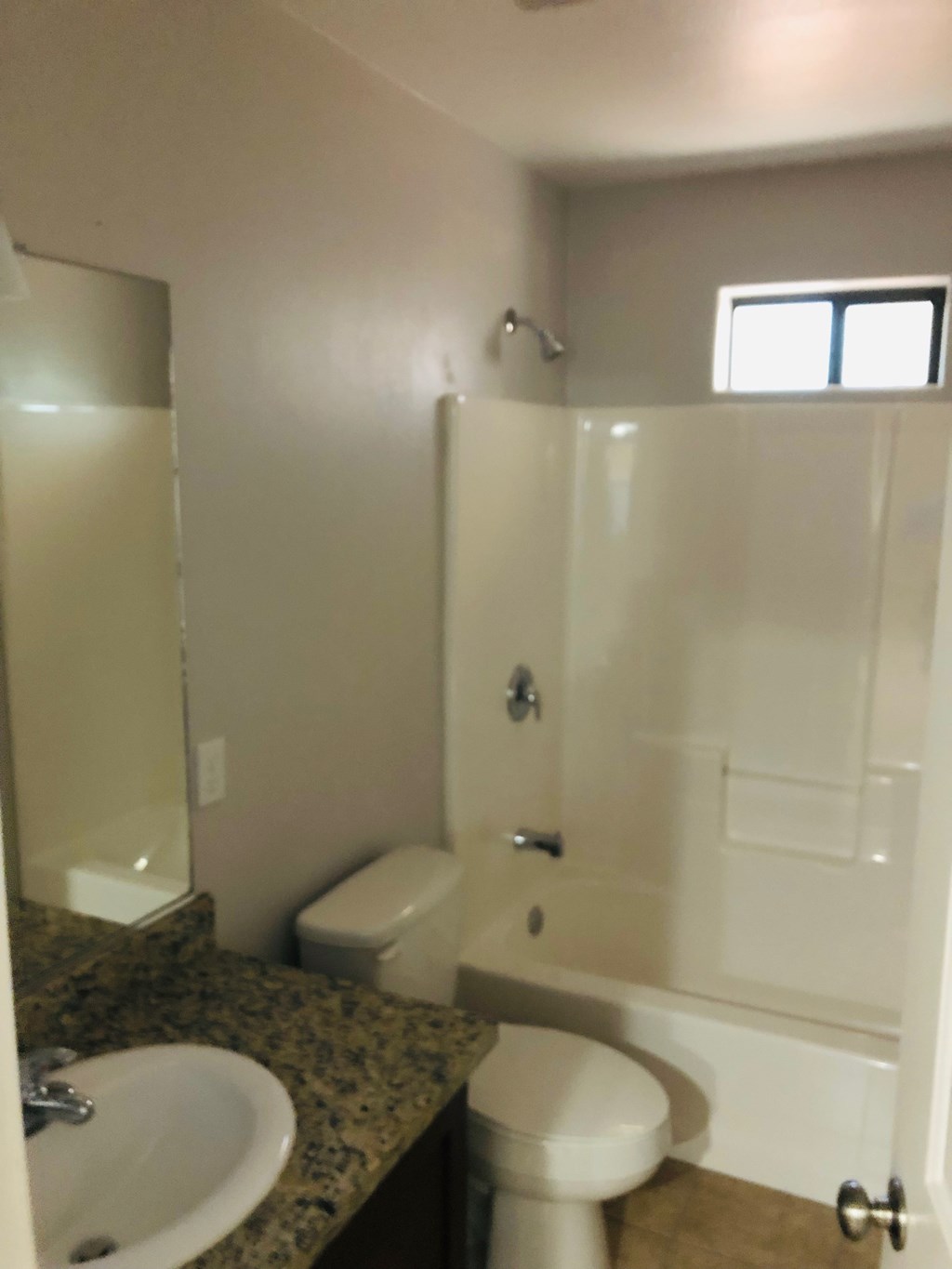 a bathroom with a sink toilet and a shower