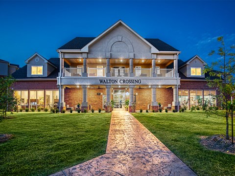 the facade of the valley crossing clubhouse at night