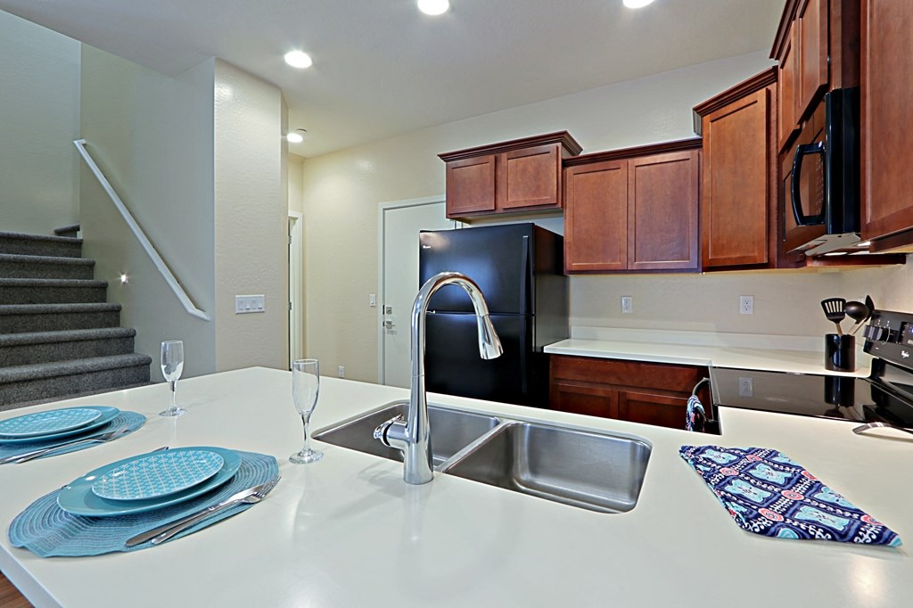 a kitchen with a sink and a counter top