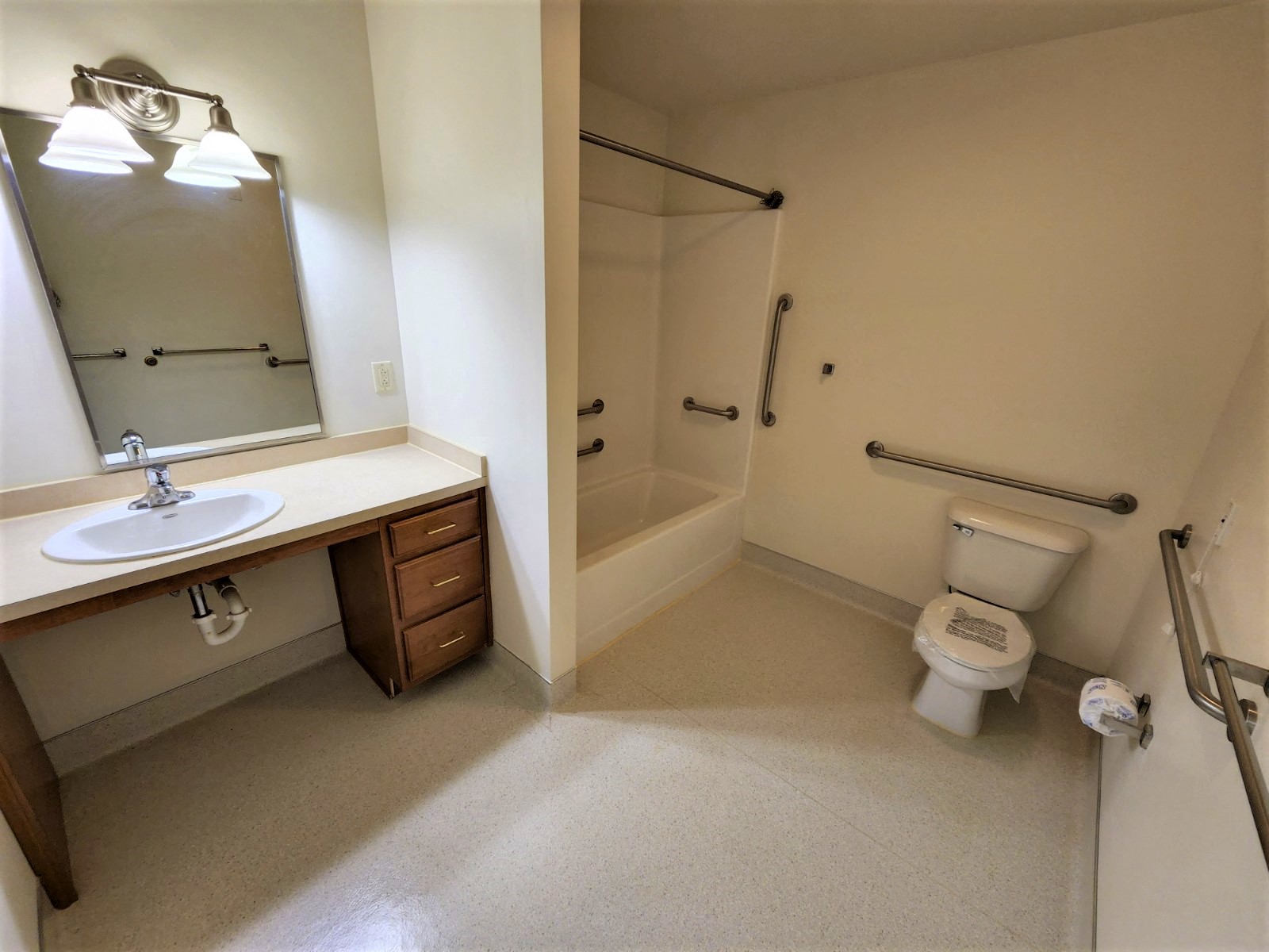 a bathroom with a sink toilet and a shower