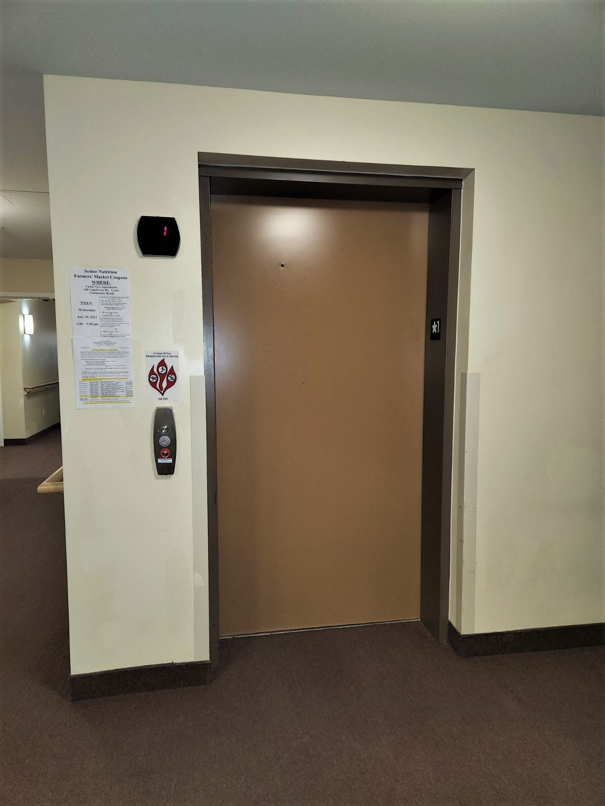 an open elevator door in an office building
