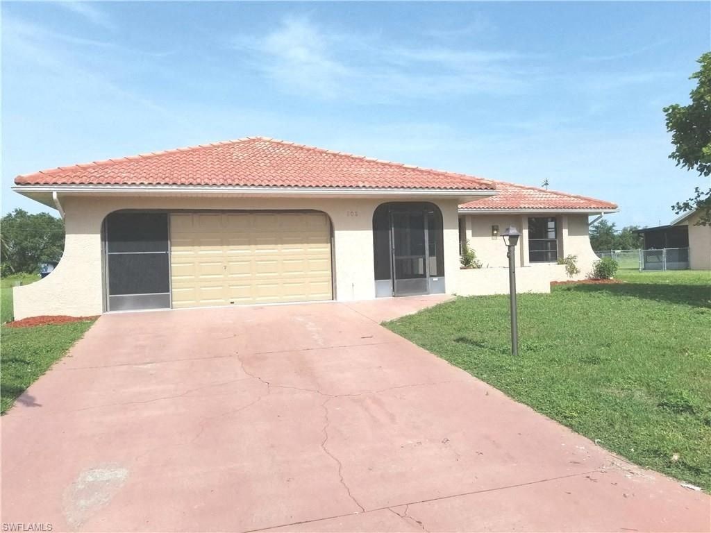 a house with a driveway and a garage door