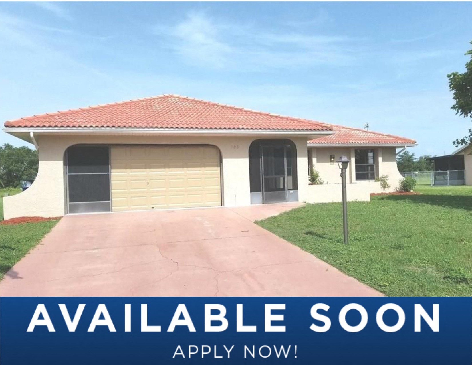 a home with a garage door and a driveway