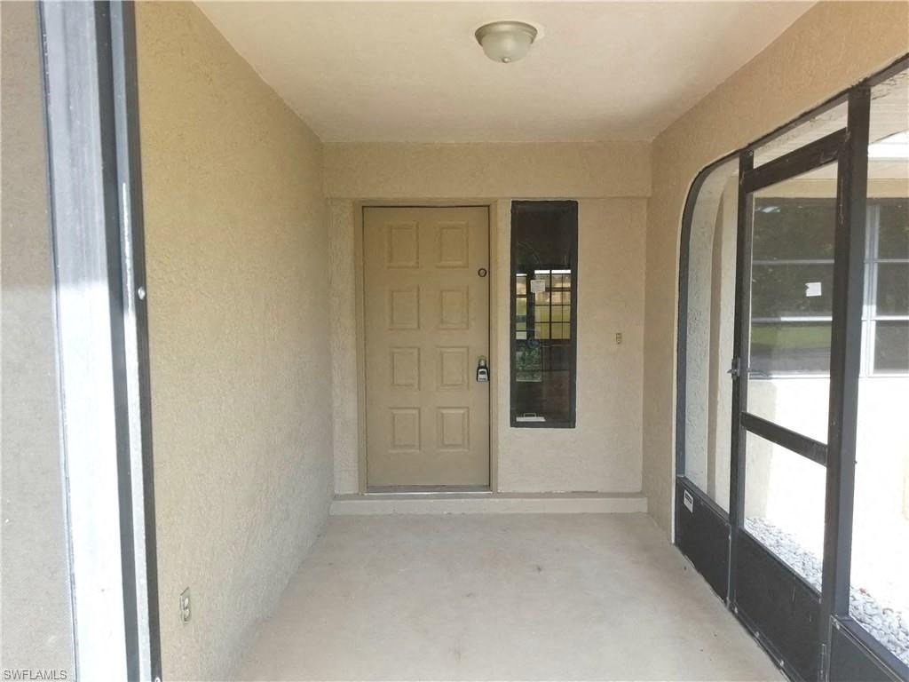 an empty room in a house with a door
