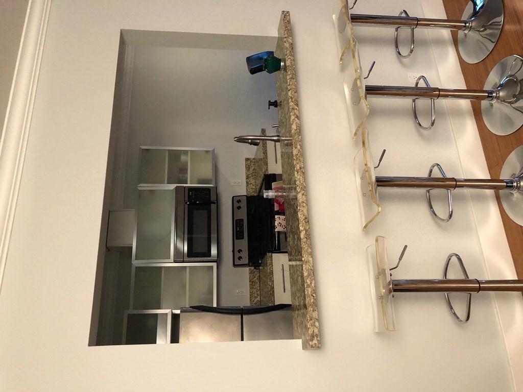 the view of a kitchen from a mirror in a hospital room