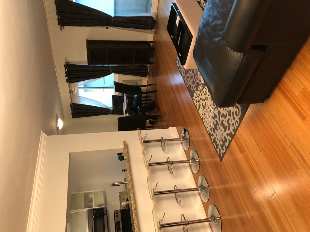 an aerial view of a living room and dining room from above