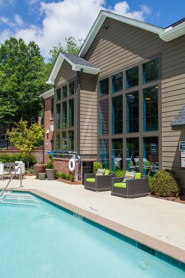 a swimming pool in front of a house