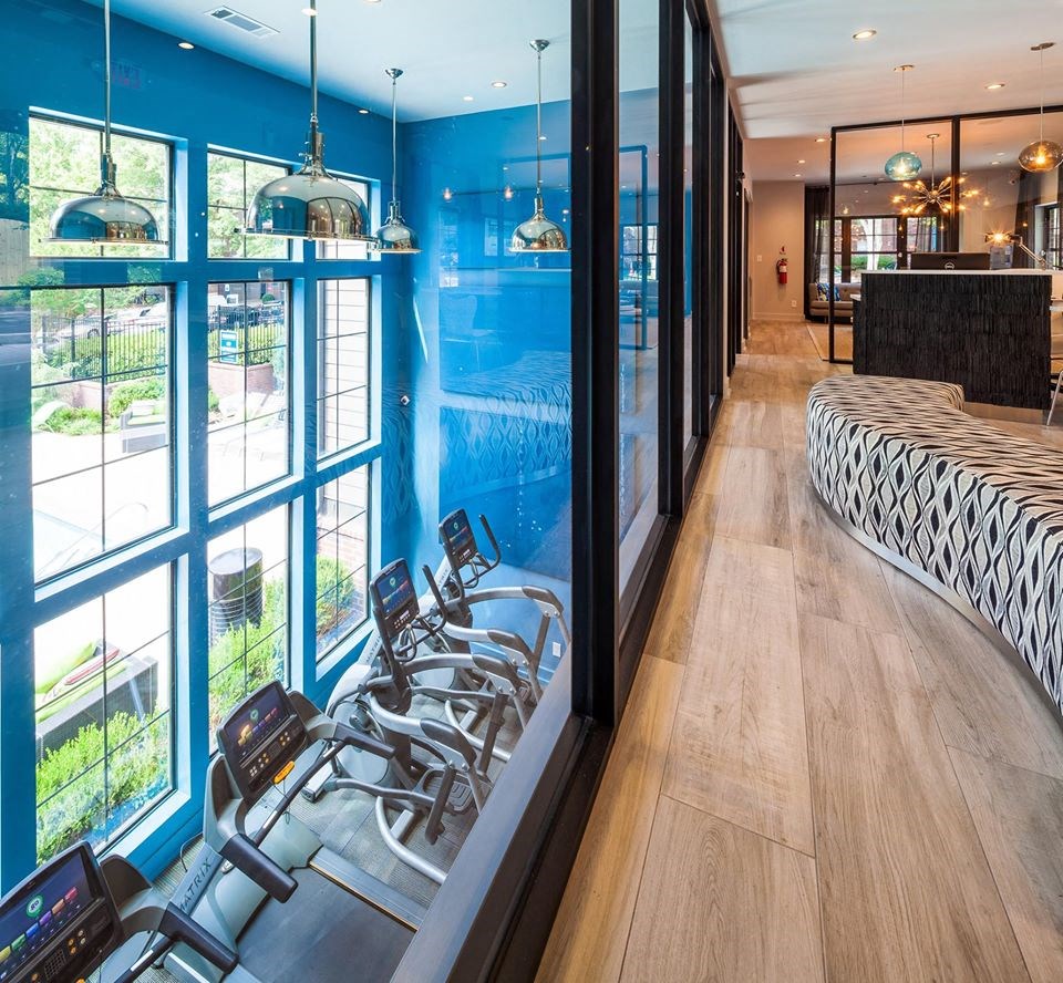 a treatment room at a spa with chairs in front of a window