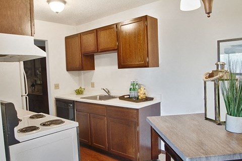 a kitchen with a stove and a sink