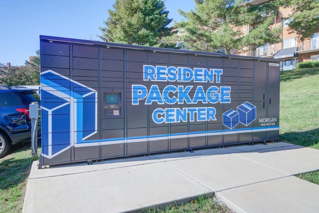 a building with a sign on the side of a sidewalk