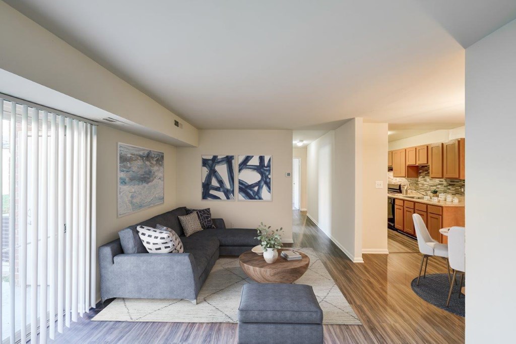 A living room with a grey couch and a coffee table.