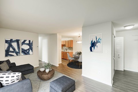 A living room with a grey sofa and a wooden coffee table.