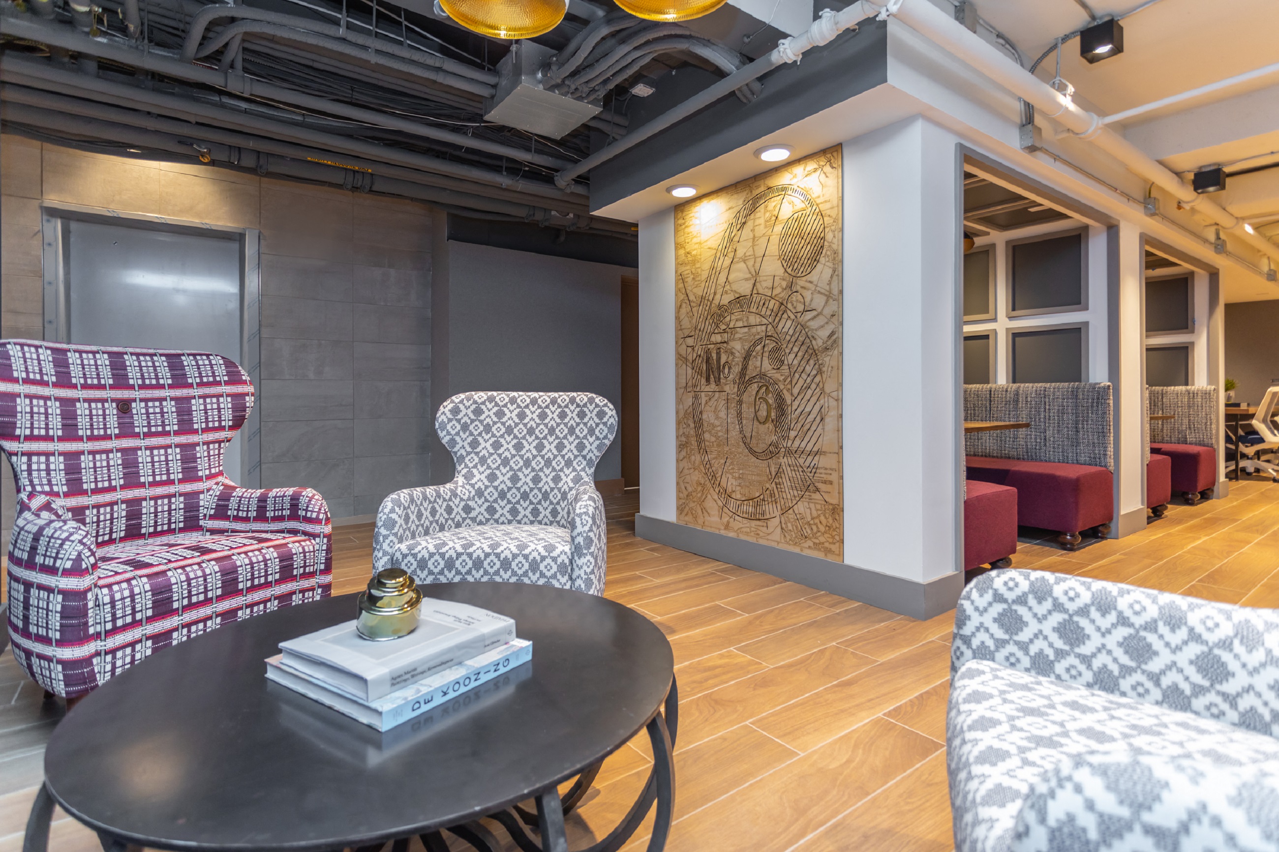 a living room with chairs and a table