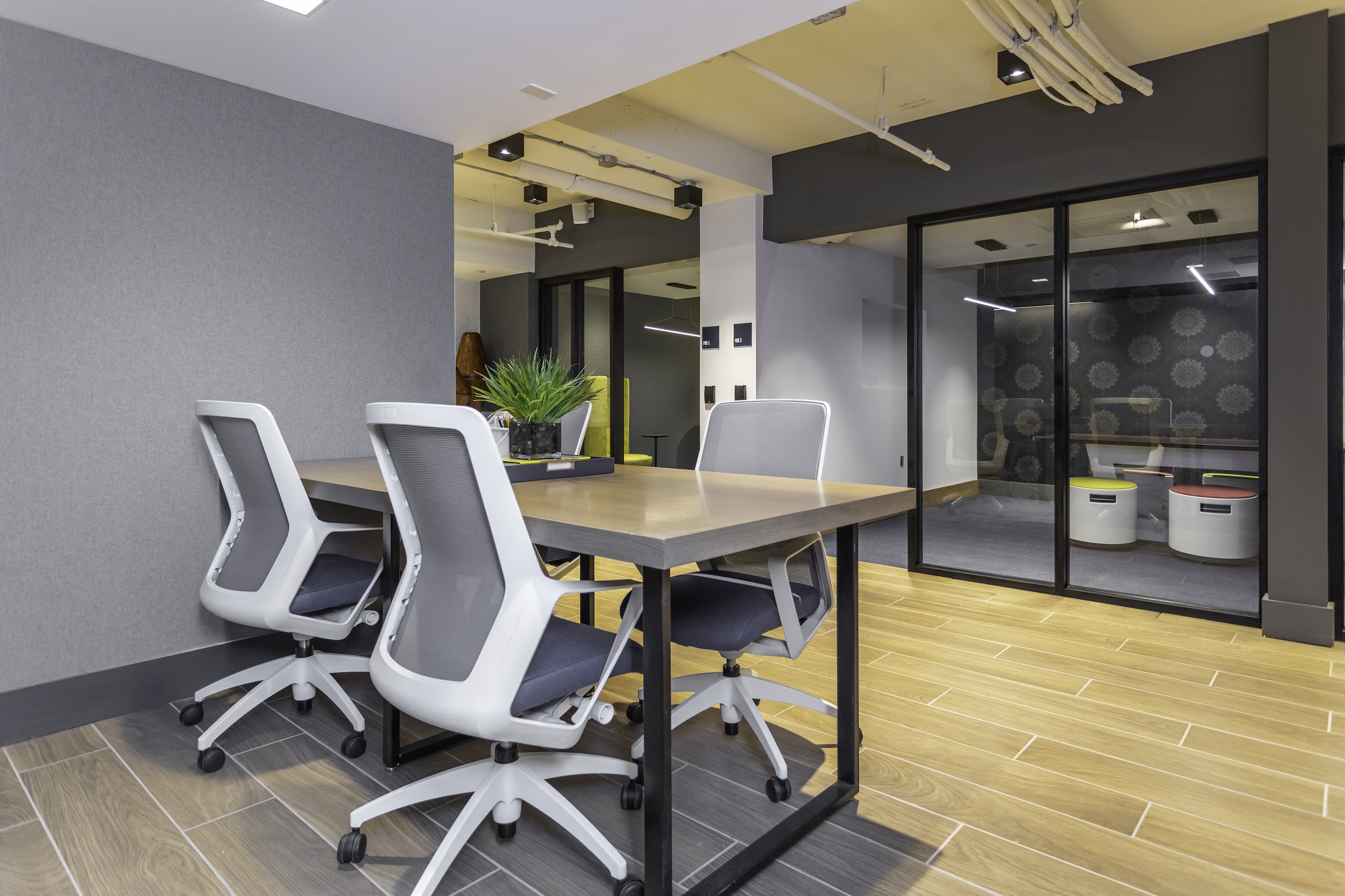 a conference room with a table and chairs