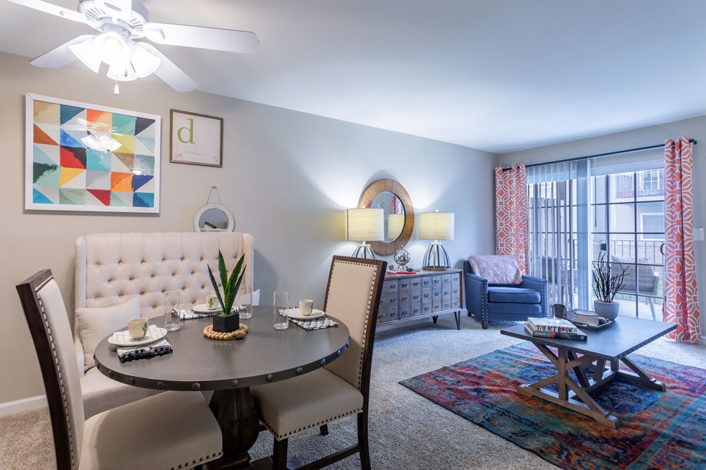 a living room with a dining room table and a couch