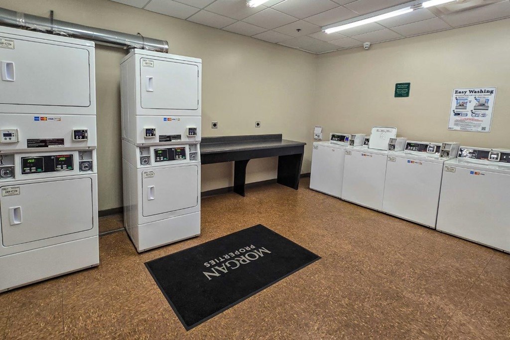 A room with a black mat on the floor that says "NO PARKING".