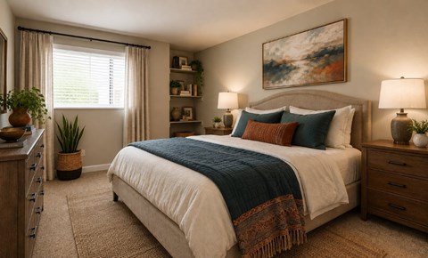 A bedroom with a large bed, a window with curtains, and a painting on the wall.