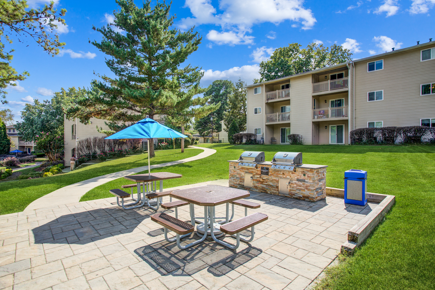 our apartments feature a patio with a fire pit and picnic table