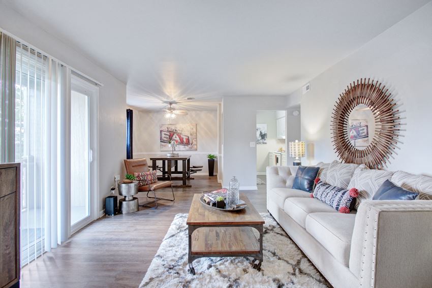 a living room with a white couch and a coffee table