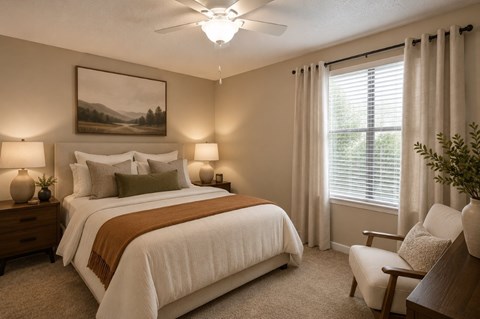 A bedroom with a large bed, a painting on the wall, and a window with curtains.