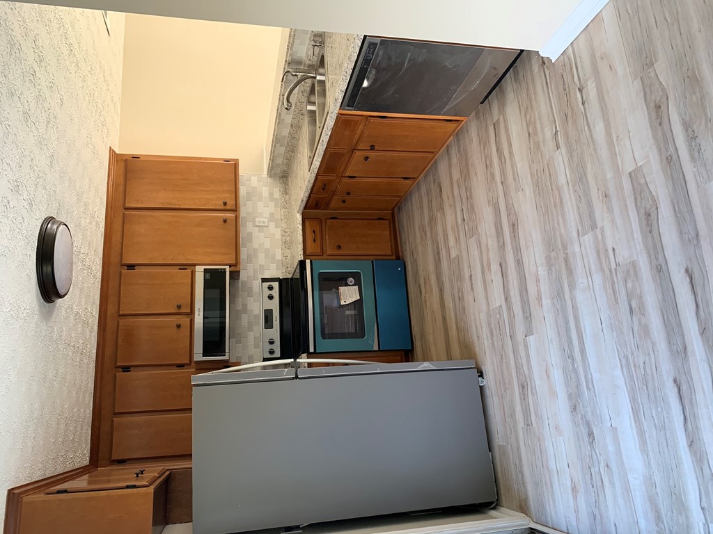 a room with a television in the middle of a wood wall