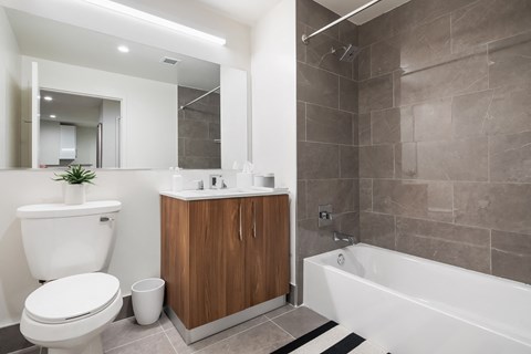 a bathroom with a toilet sink and bath tub