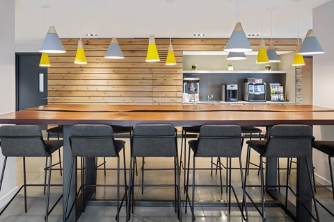 a bar with chairs and a counter in a restaurant