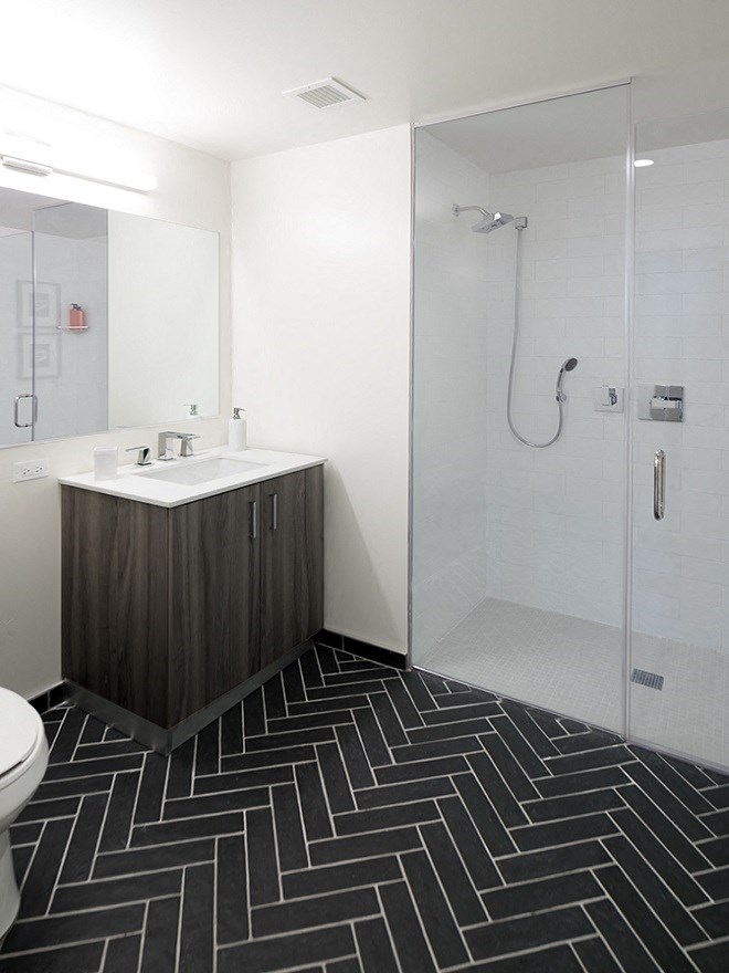 a bathroom with a sink and a shower