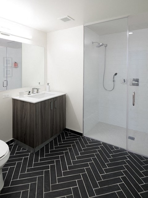 a bathroom with a sink and a shower