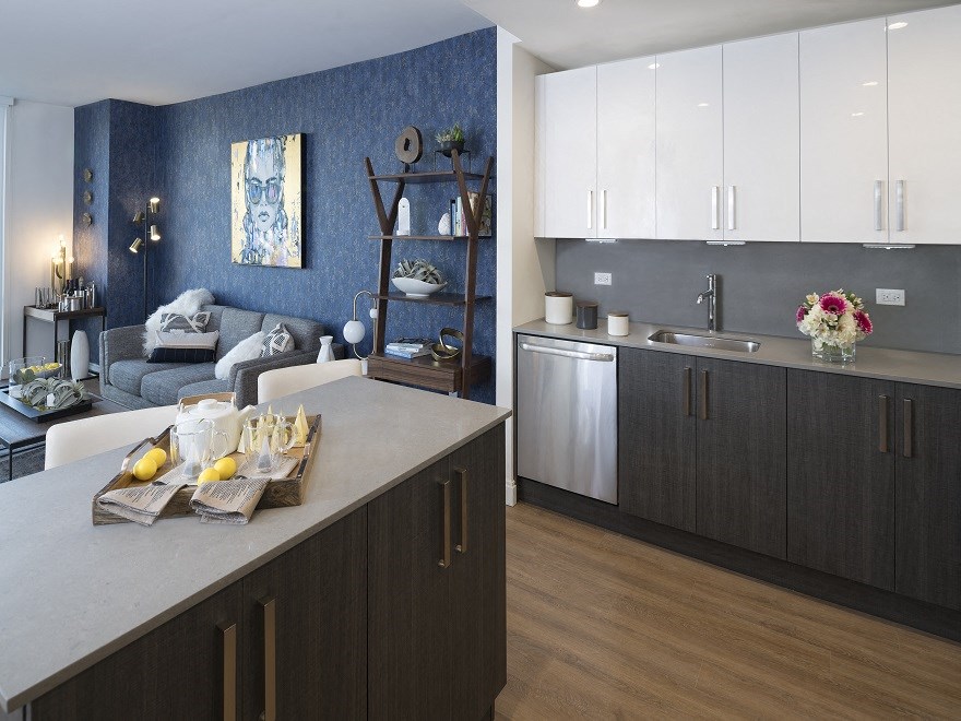 a kitchen and living room in an apartment