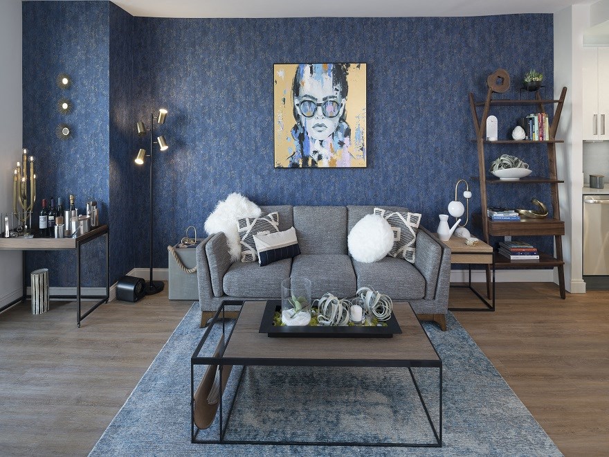 a living room with blue walls and a couch and a coffee table