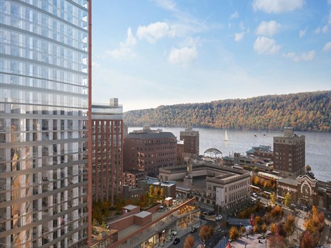 an aerial view of the city of falls church with the water and mountains in the
