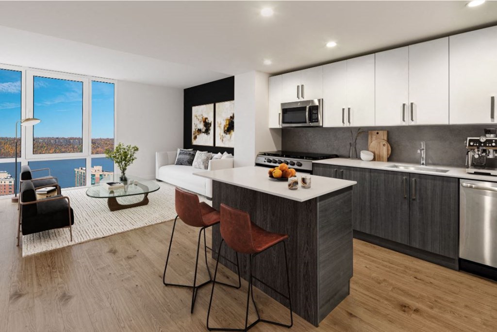 an open kitchen and living room with a view