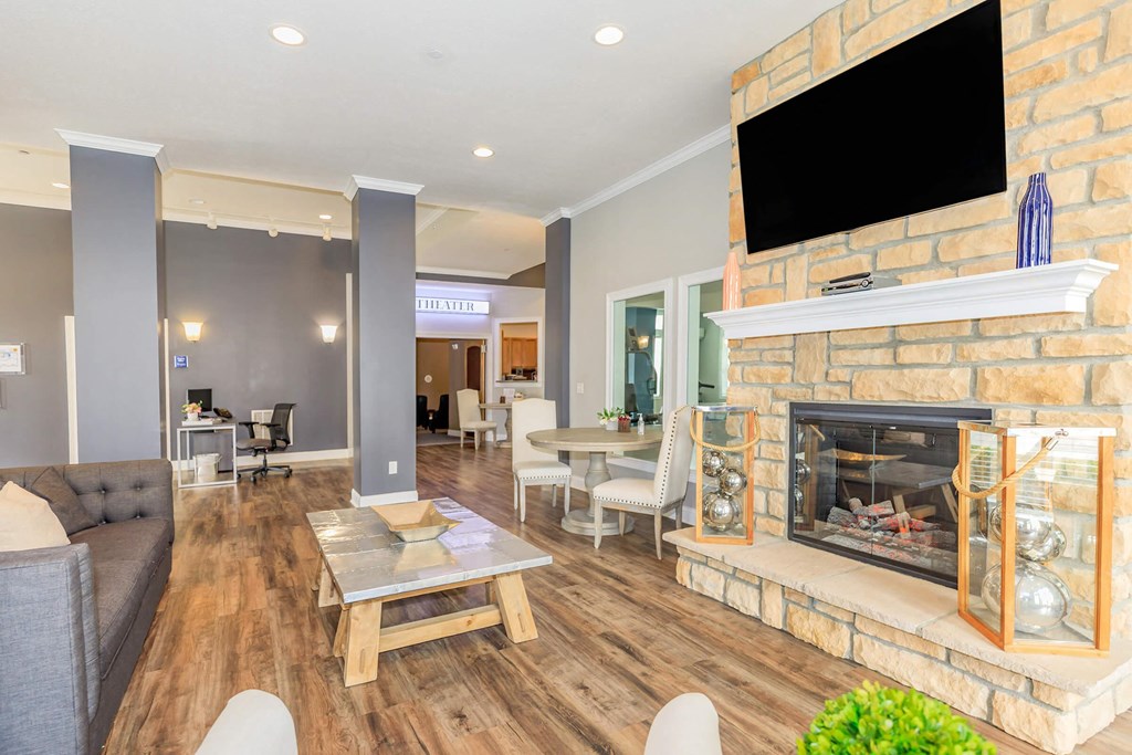 a living room with a fireplace and a television