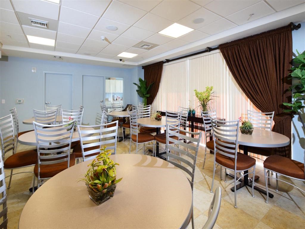 a dining room with tables and chairs