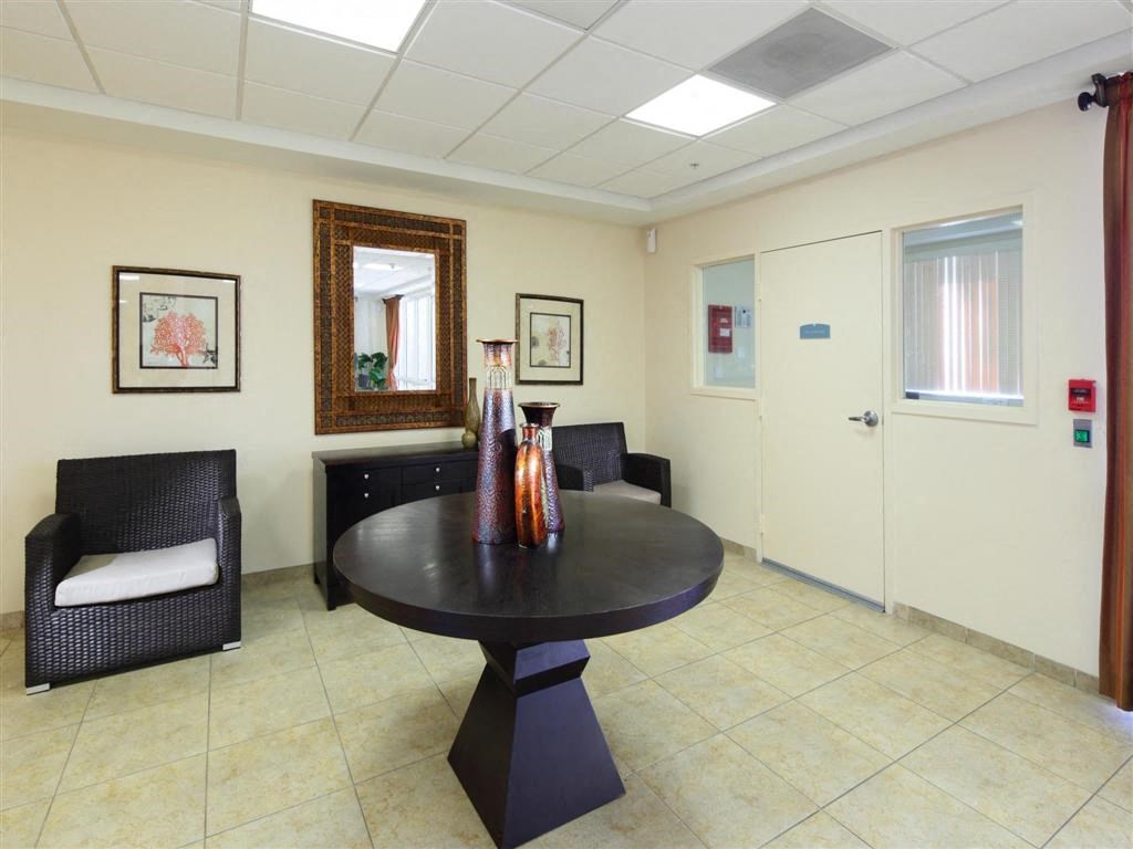 a dining room with a table and chairs