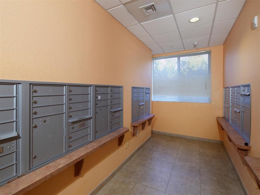 a locker room with a row of lockers and a window